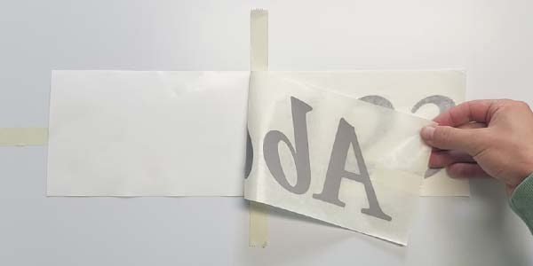 Schriftzug Aufkleber aufklappen